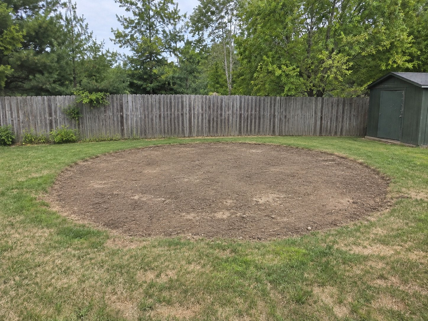 Level circular soil footprint after an above-ground pool was removed.