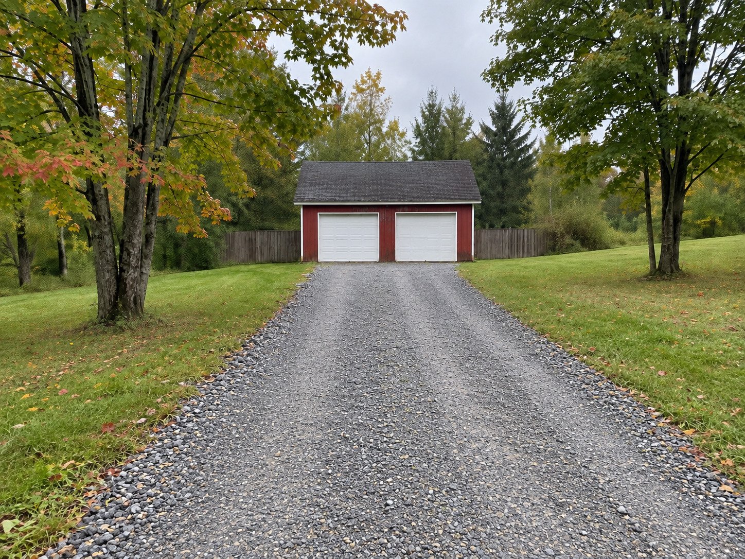 Same gravel driveway regraded and topped up with compacted crushed stone.
