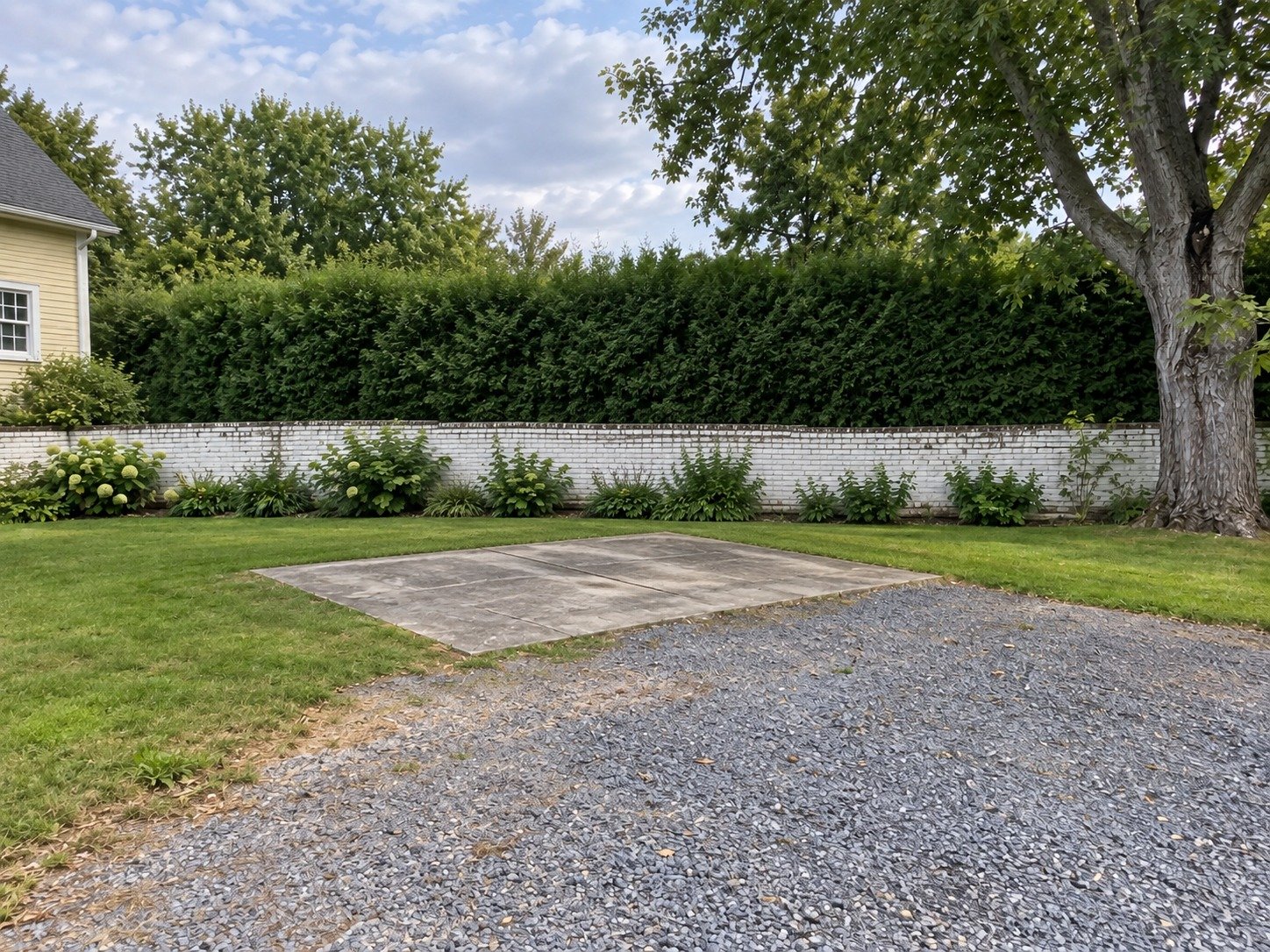 The same service court after workshop demolition, with its existing concrete slab cleared.