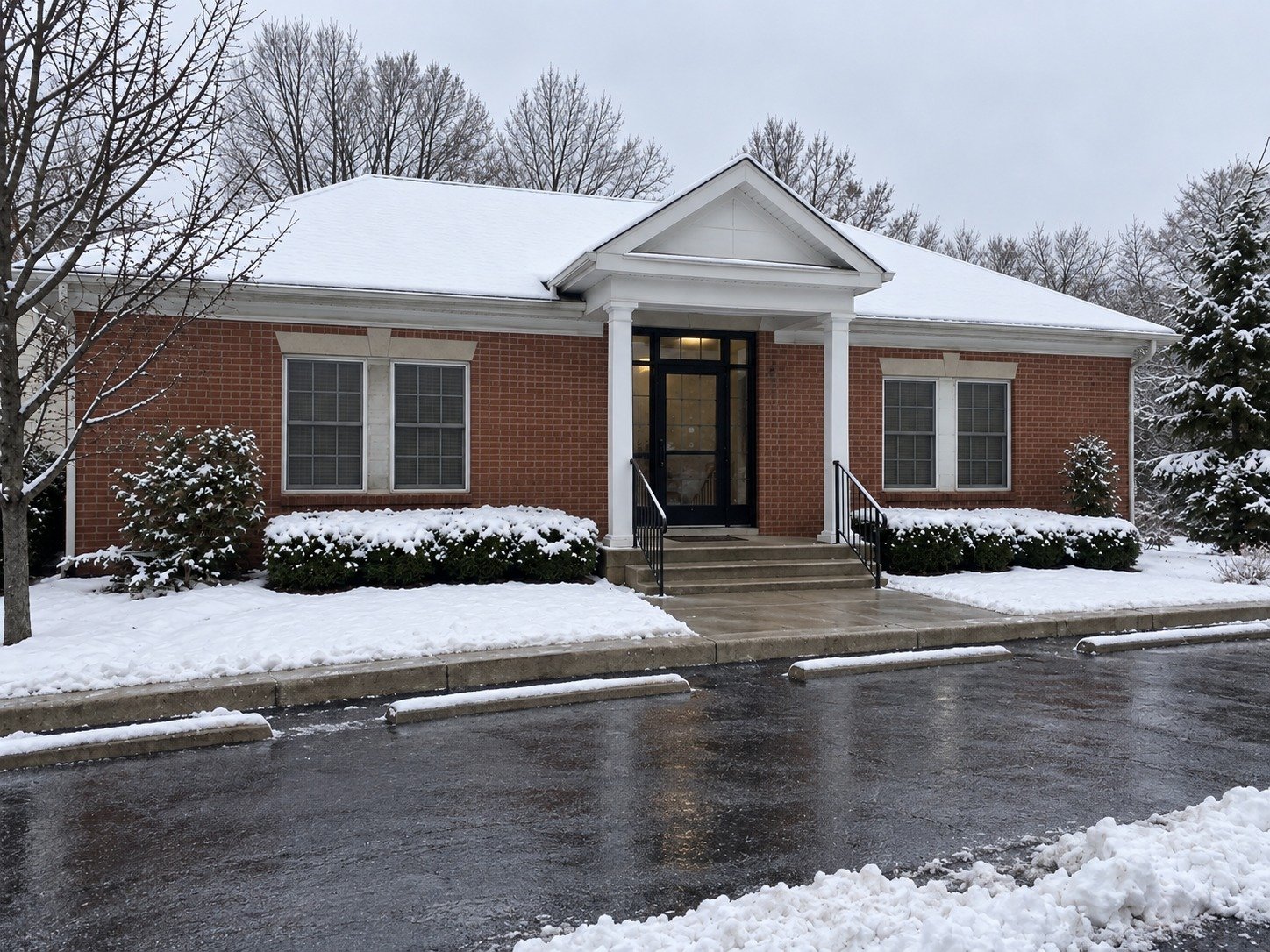The same office with parking, entrance path and steps cleared of snow.