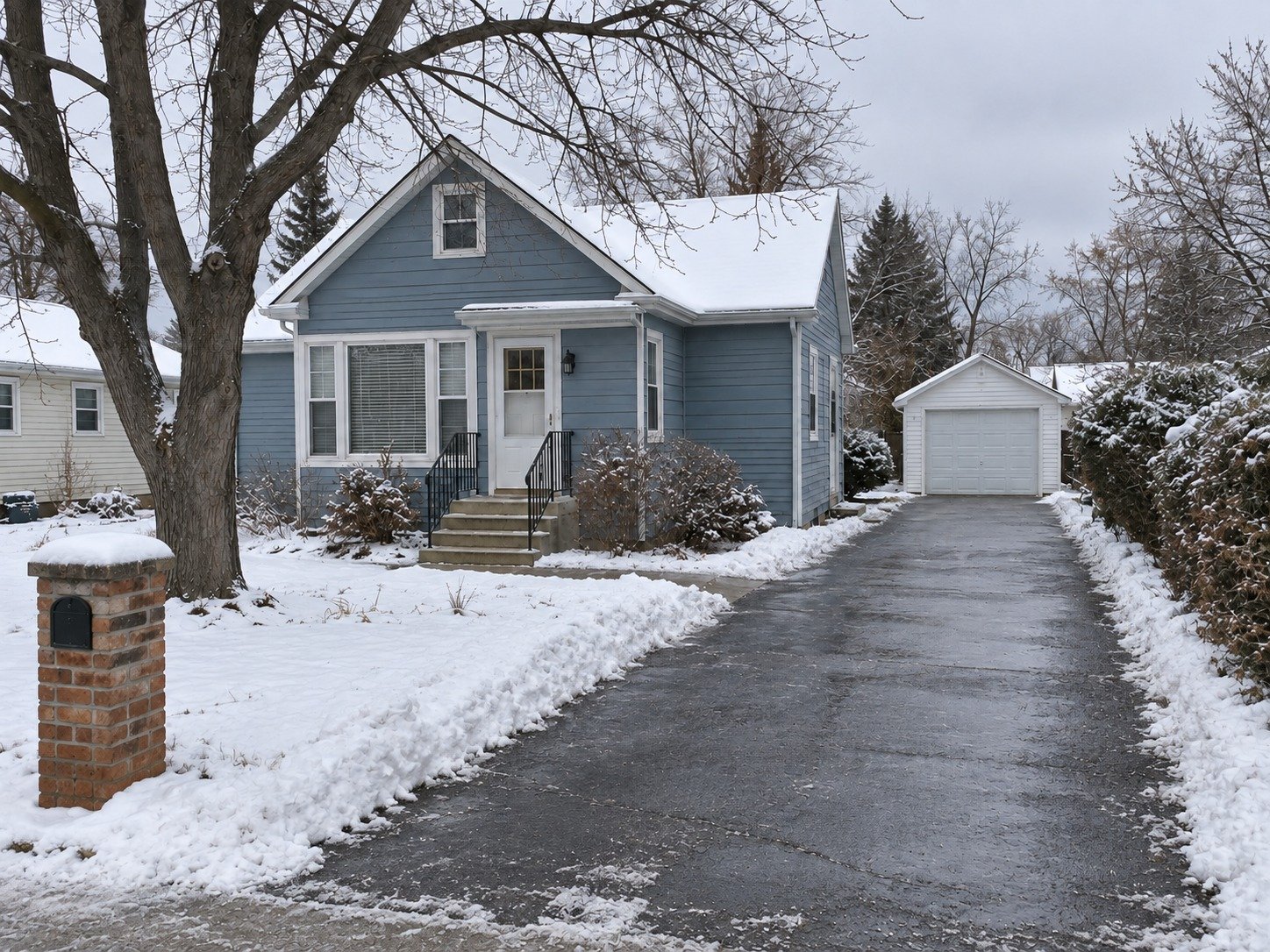 The same cottage with a clear route from the street to its garage and front steps.