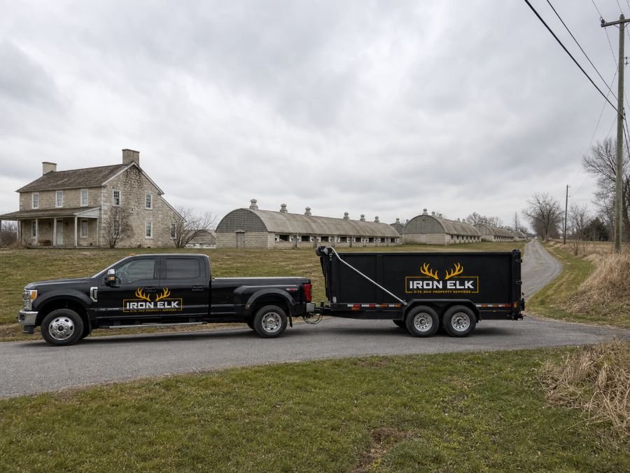 The truck and trailer parked in a residential driveway.