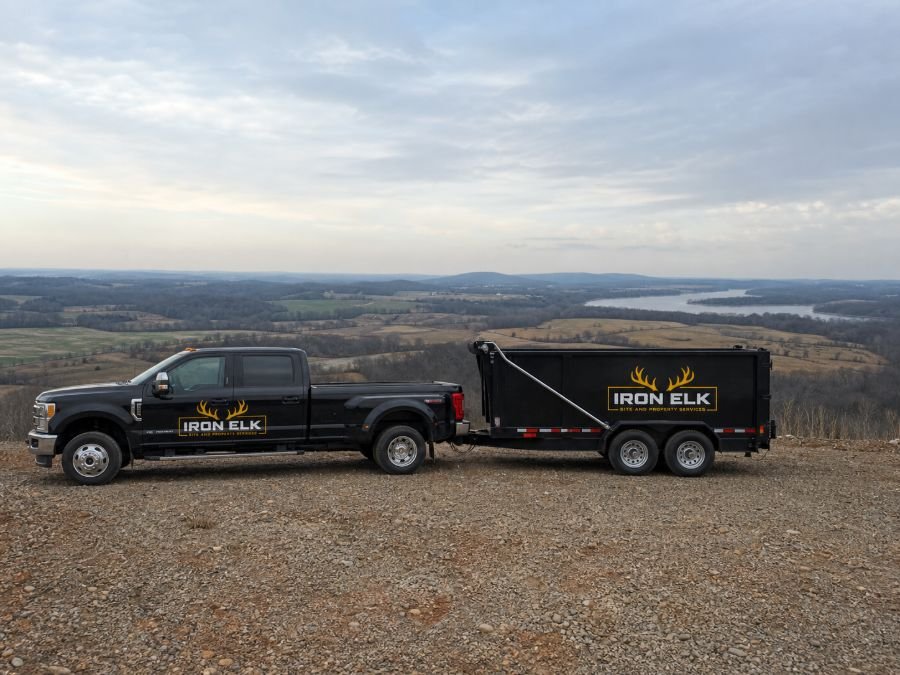 An Iron Elk truck and dump trailer at a scenic overlook.