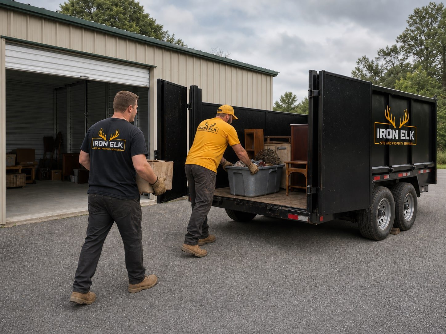 A storage unit half emptied with the trailer backed up to it.