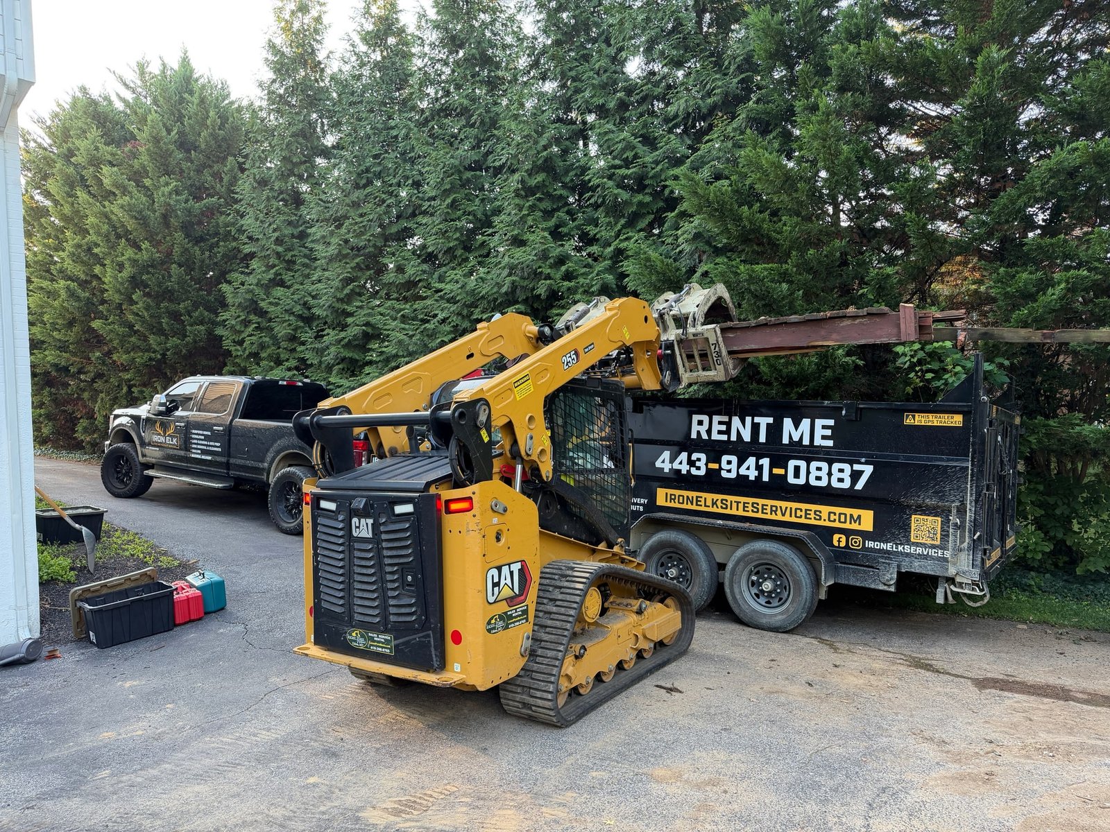 A loaded trailer of renovation debris leaving a job site.