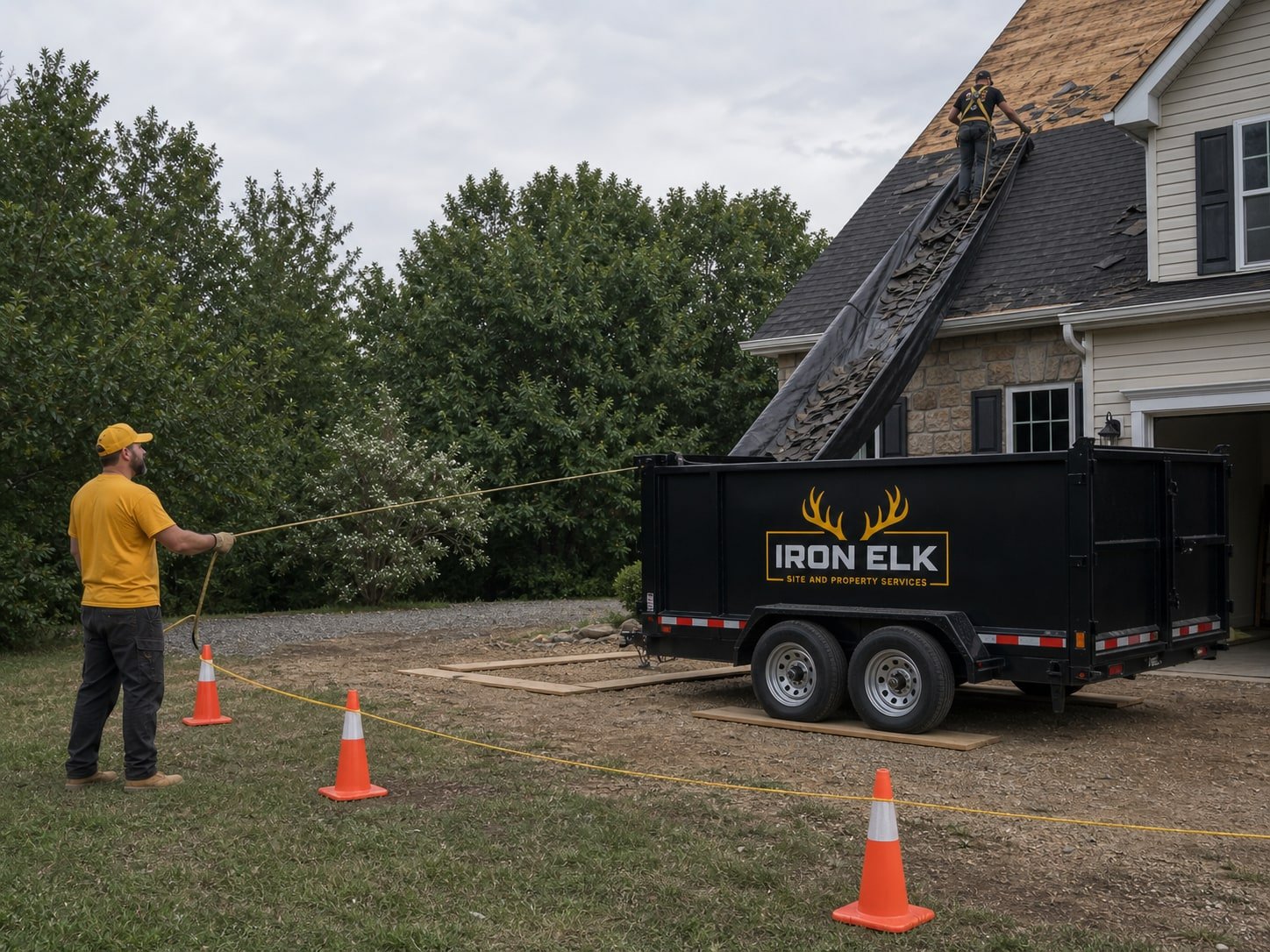 Shingles sliding off a roof tarp into the trailer.
