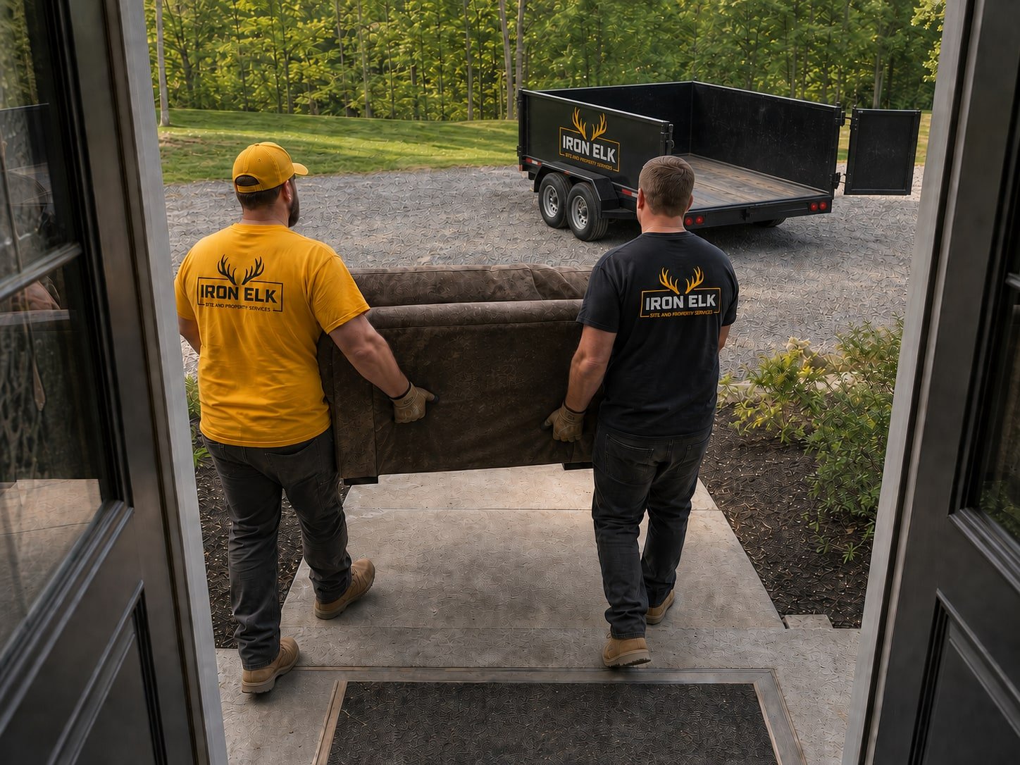 A couch being carried out the front door.