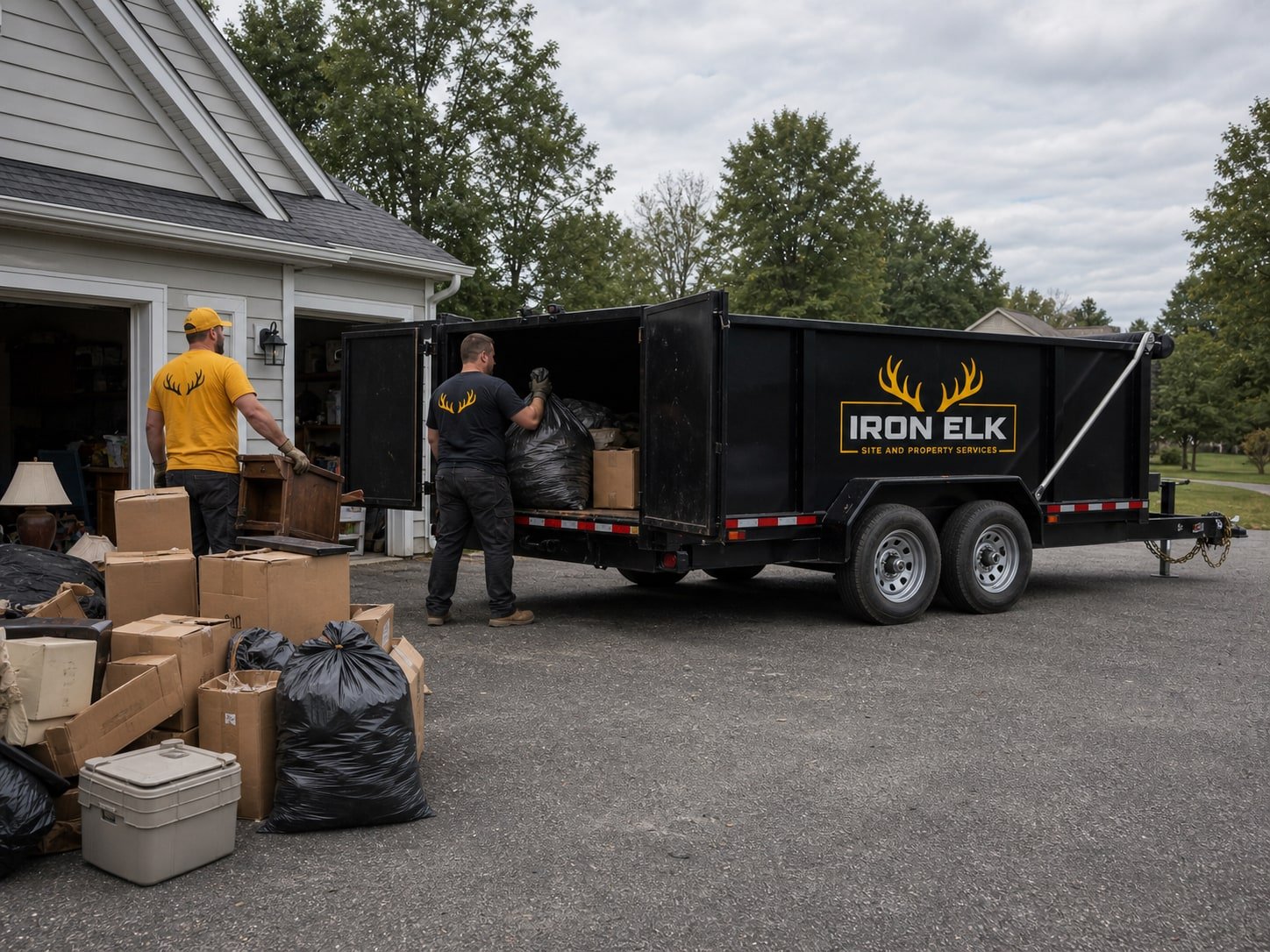 A garage half emptied, boxes staged in the driveway.