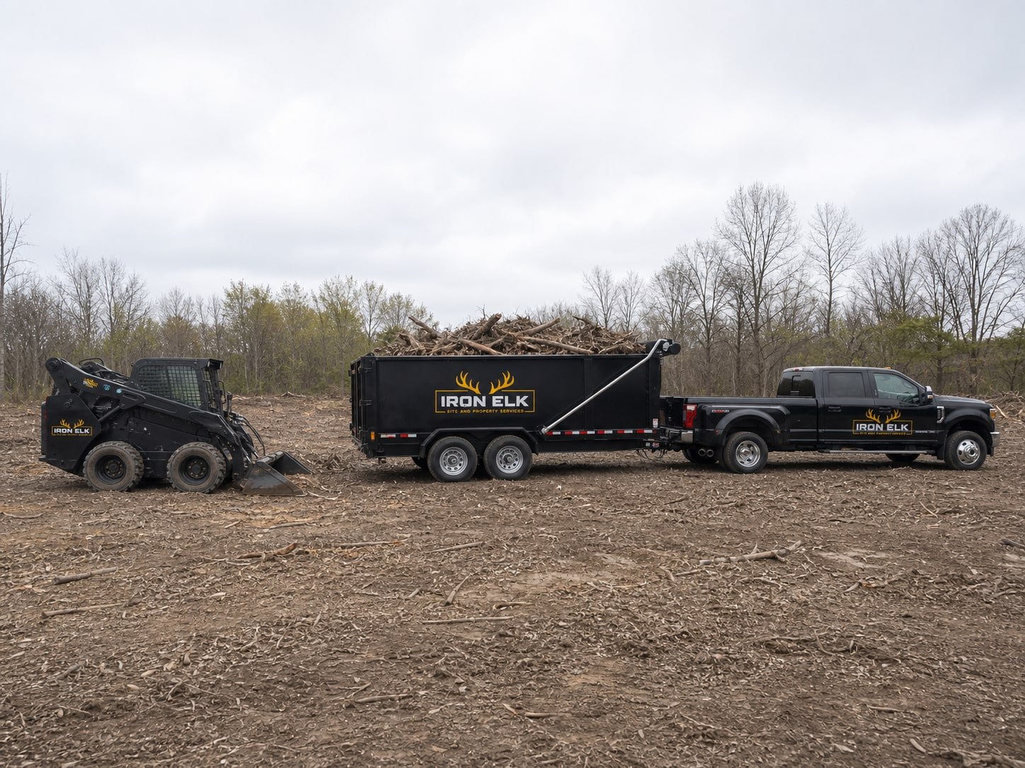 A cleared lot with the brush pile loaded for hauling.