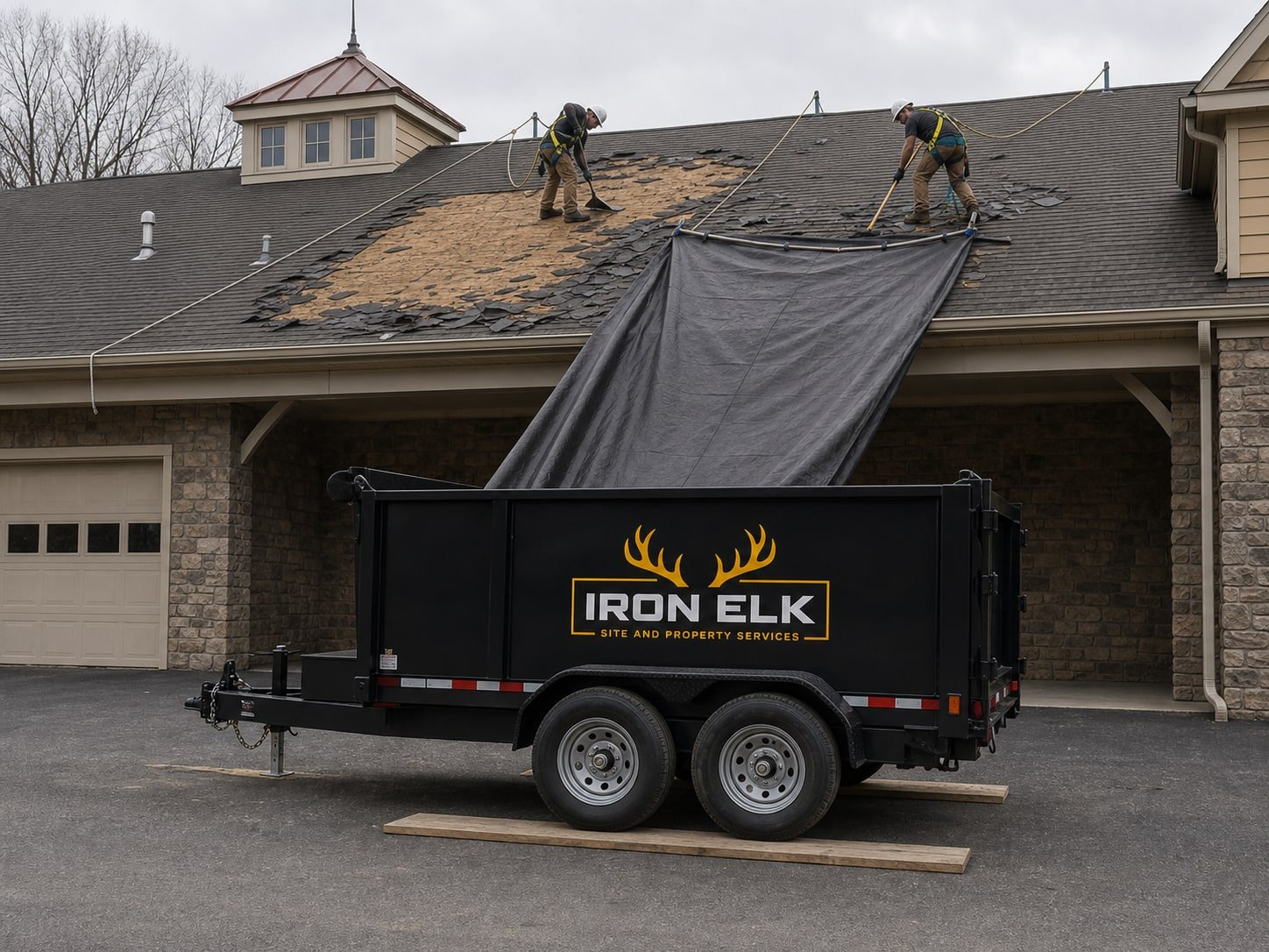 The trailer under the drop zone as shingles come off the roof.