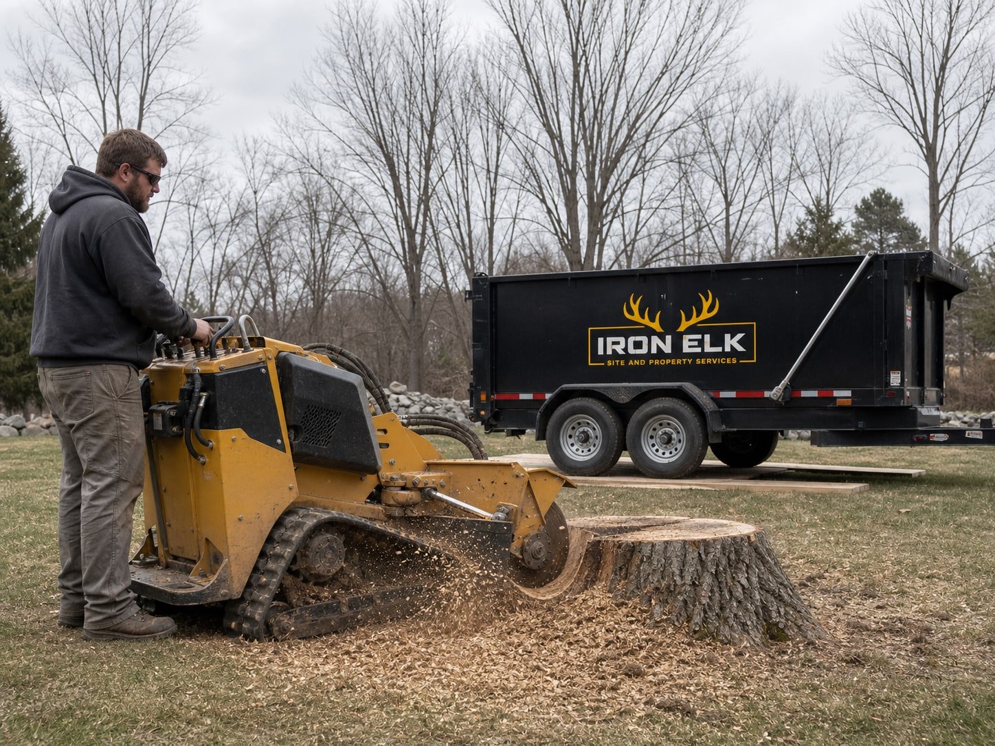 A stump grinder working with chips flying.